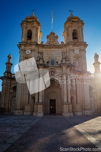 Image of Majestic Zabbar Parish Church in Malta against the evening sky at sunset.