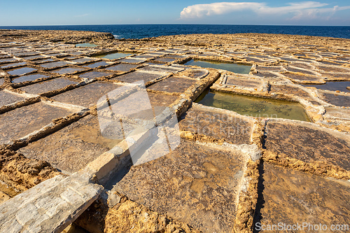 Image of Traditional salt pans in Zabbar Bay on the beach of island Malta.