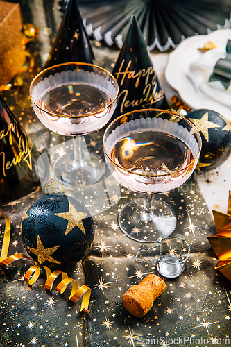 Image of Elegant place setting for Christmas, New Years Eve, glasses of sparkling wine