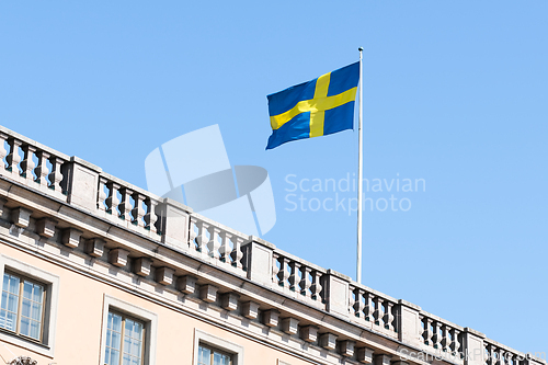 Image of The flag of Sweden on a building