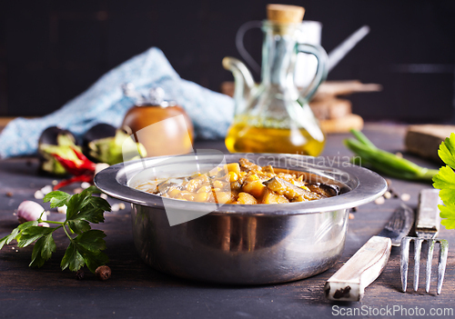 Image of Vegetable stew. in metal bowl. Hot foodstuff.