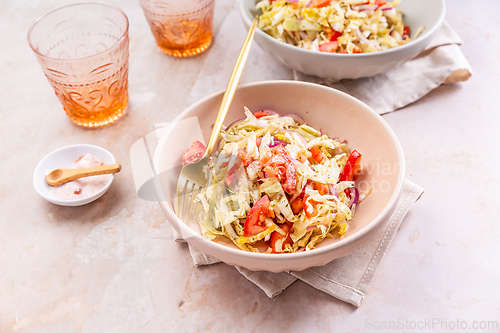 Image of Healthy cabbage salad with tomatoes, homemade winter salad