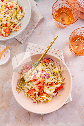 Image of Healthy cabbage salad with tomatoes, homemade winter salad