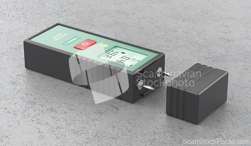 Image of Measuring humidity of concrete with moisture meter