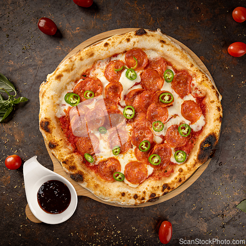 Image of Round pepperoni pizza with melted mozzarella