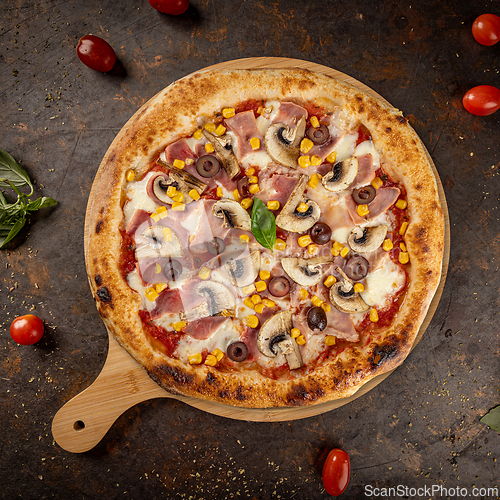Image of Freshly baked pizza featuring ham