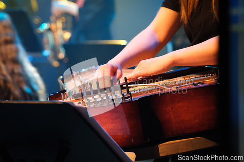 Image of Playing the traditional Finnish instrument kantele