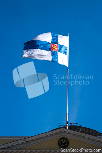 Image of The  flag of Finland with a blue sky