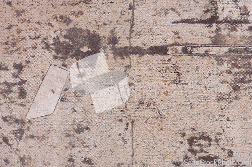 Image of Old and dirty canvas with a patch
