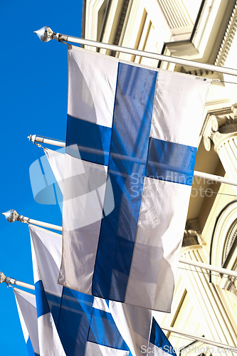 Image of Finnish flags on a building wall