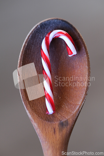 Image of Candy cane on a wooden spoon