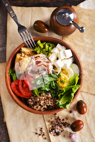 Image of Delicious healthy breakfasts, buckwheat with boiled egg and meat and cheese