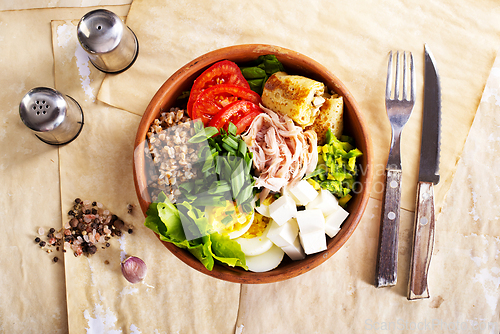 Image of Delicious healthy breakfasts, buckwheat with boiled egg and meat and cheese