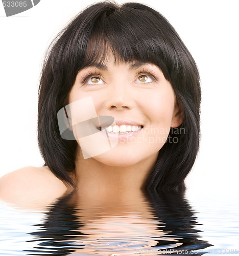 Image of happy woman looking up