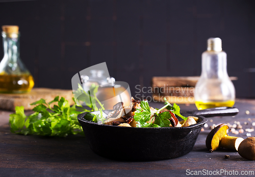 Image of meat stew with mushrooms in cream sauce in pan