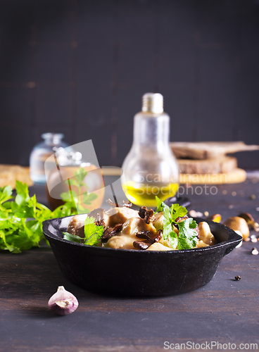 Image of meat stew with mushrooms in cream sauce in pan