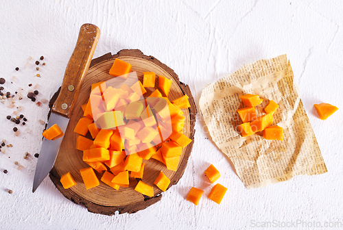 Image of raw pumpkin cubes on board