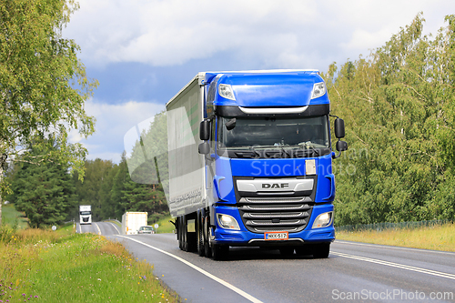 Image of Blue DAF XF Truck Semi Trailer Transports Goods