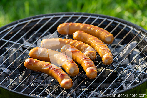 Image of sausages on grill