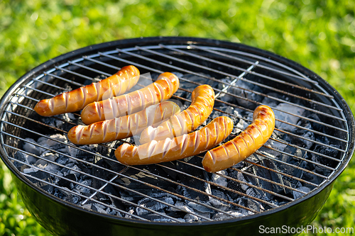 Image of sausages on grill