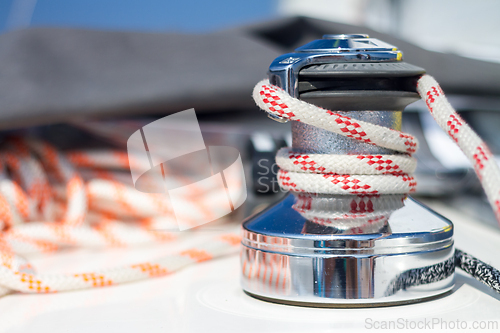 Image of Winch with rope on sailing boat.