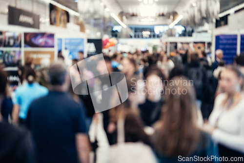 Image of Abstract blurred people at exhibition hall of expo event trade show. Business convention show or job fair. Business concept background.