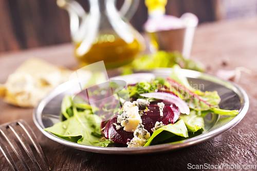 Image of Tasty salad of beetroot, cheese and nuts. Copy space.