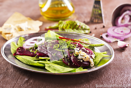 Image of Tasty salad of beetroot, cheese and nuts. Copy space.