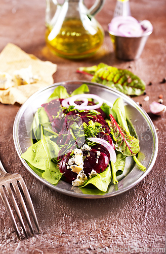 Image of Tasty salad of beetroot, cheese and nuts. Copy space.