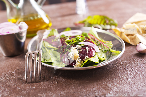 Image of Tasty salad of beetroot, cheese and nuts. Copy space.