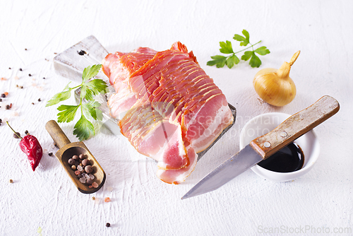 Image of smoked bacon slices for hot pot on a table