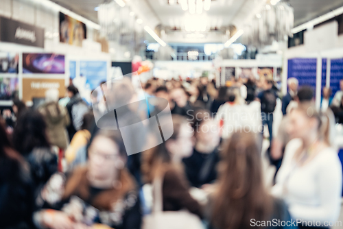 Image of Abstract blurred people at exhibition hall of expo event trade show. Business convention show or job fair. Business concept background.