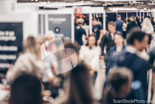 Image of Abstract blurred people at exhibition hall of expo event trade show. Business convention show or job fair. Business concept background.