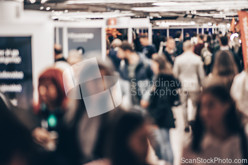 Image of Abstract blurred people at exhibition hall of expo event trade show. Business convention show or job fair. Business concept background.