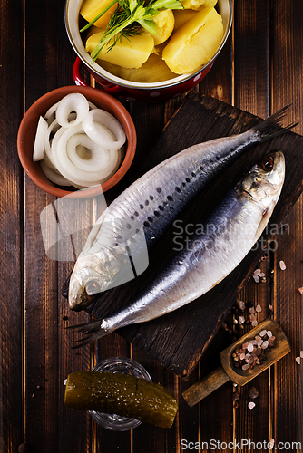 Image of Herring or Baltic herring on wooden table
