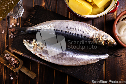 Image of Herring or Baltic herring on wooden table