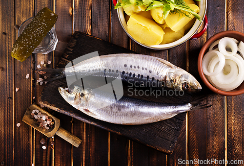 Image of Herring or Baltic herring on wooden table