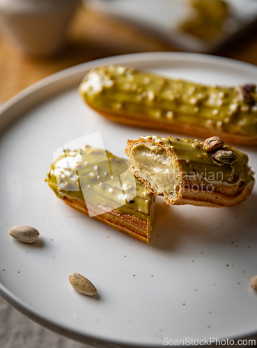 Image of Pistachio eclairs with light green icing