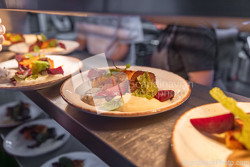 Image of Plates with delicious roasted meat