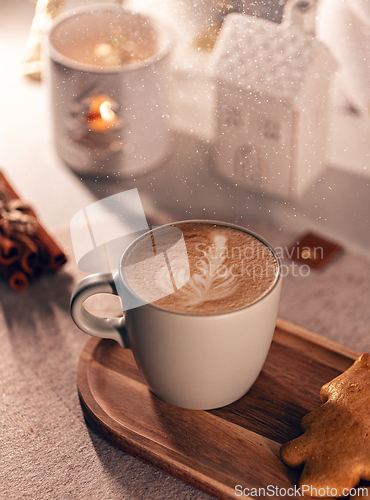 Image of Warm cappuccino on a wooden tray