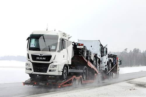 Image of Vehicle Carrier Transports New Trucks