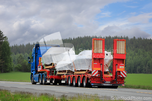 Image of Truck Transports Three Husky Boats