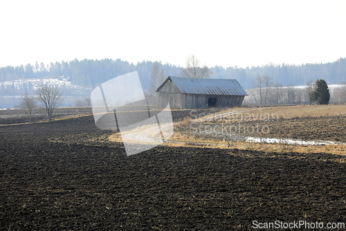 Image of Landscape with Rural Barn on Misty April Morning