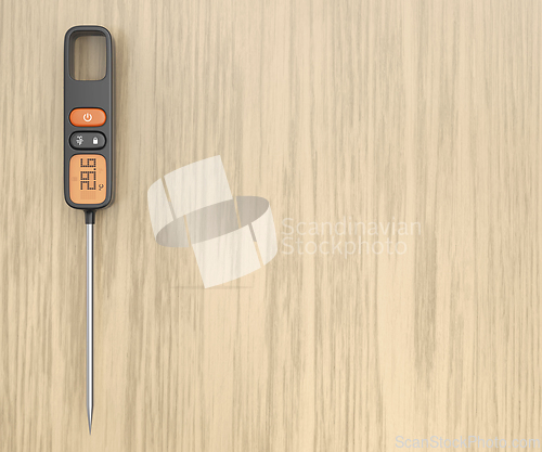 Image of Food thermometer on wooden table