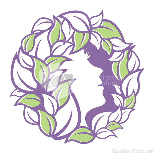 Image of female face in profile inside a wreath of leaves