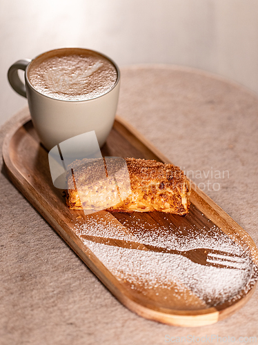 Image of Delicious crunchy pastry and cappuccino