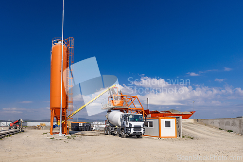 Image of Concrete mixing plant with truck