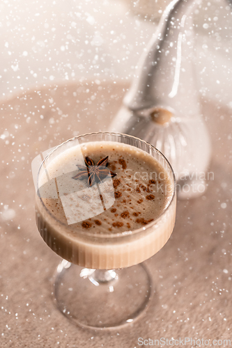 Image of Eggnog cocktail decorated with star anise
