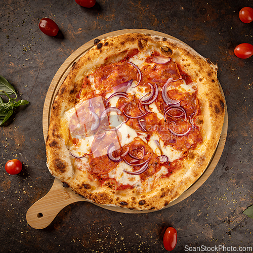 Image of Round pizza with pepperoni,