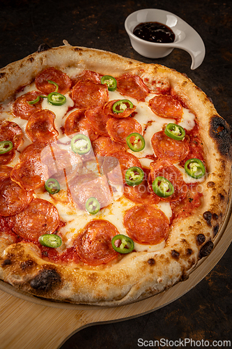 Image of Close up of pizza with melted mozzarella